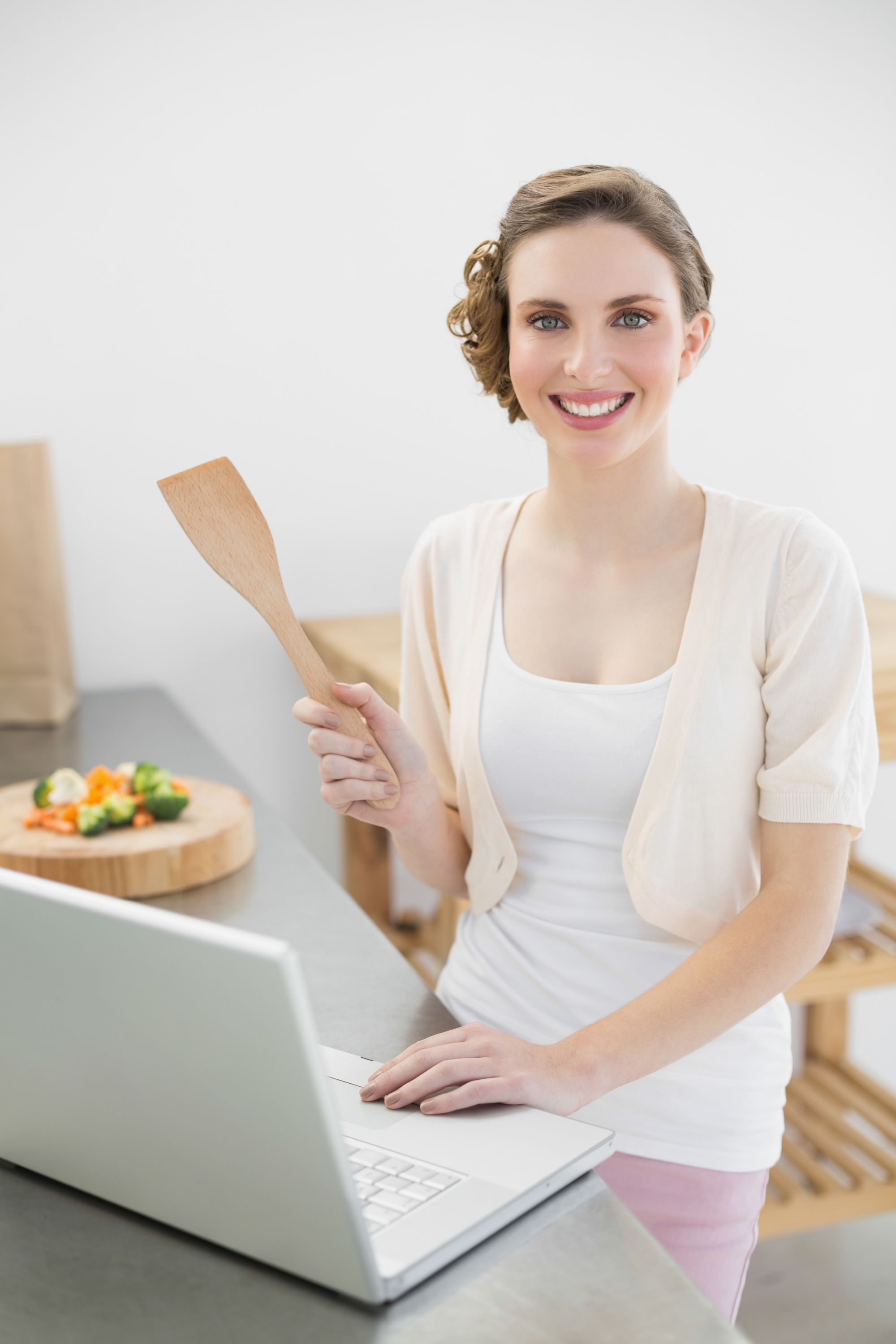 Instructor smiling in a small kitchen studio